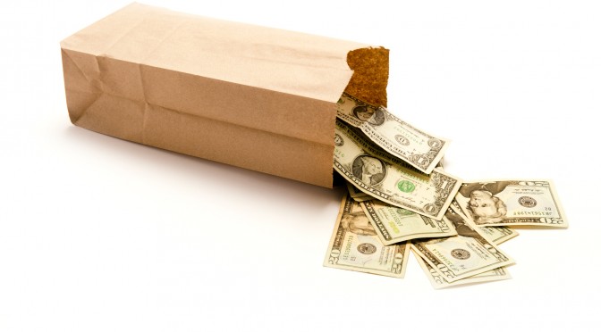 Brown paper bag with money